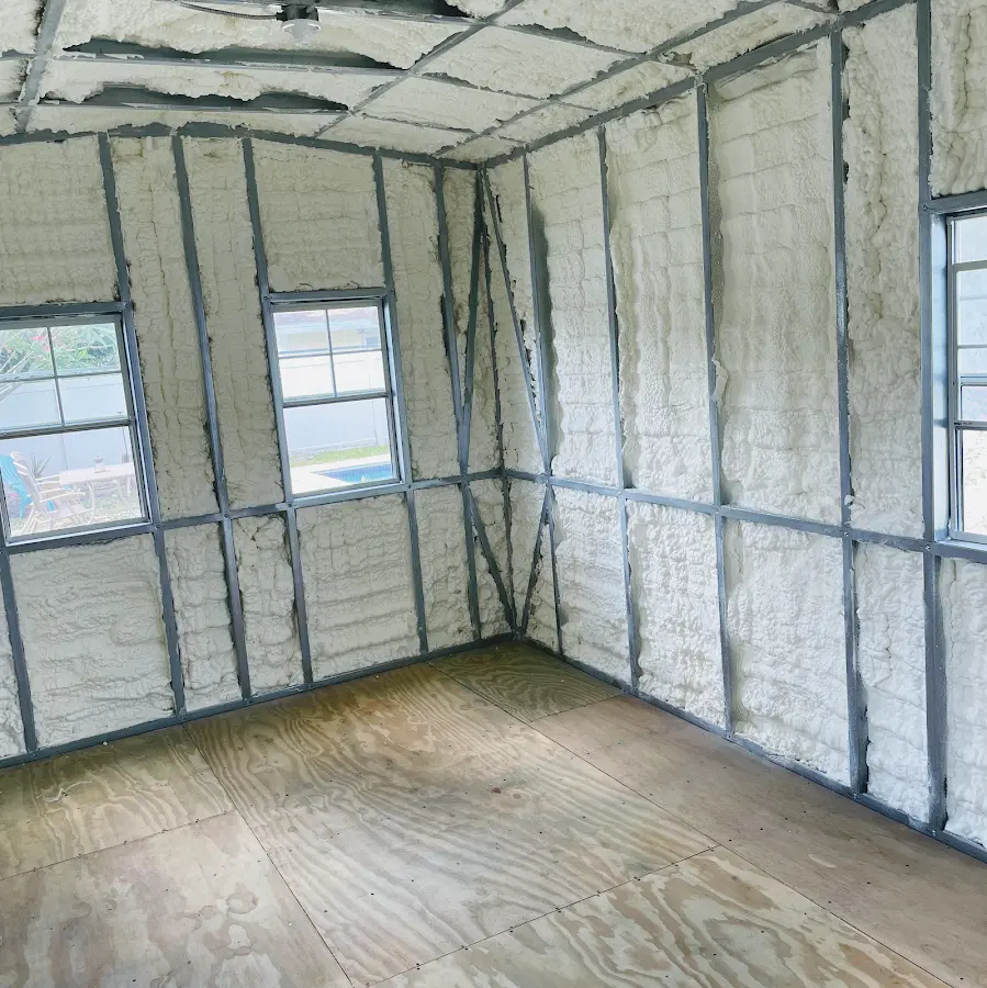 Closed-cell spray foam insulation applied to wall cavities in a residential project in Belfast